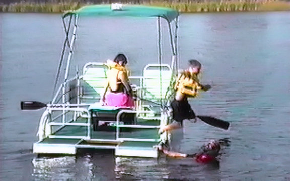 Family enjoying Swimming off their Little River Boat